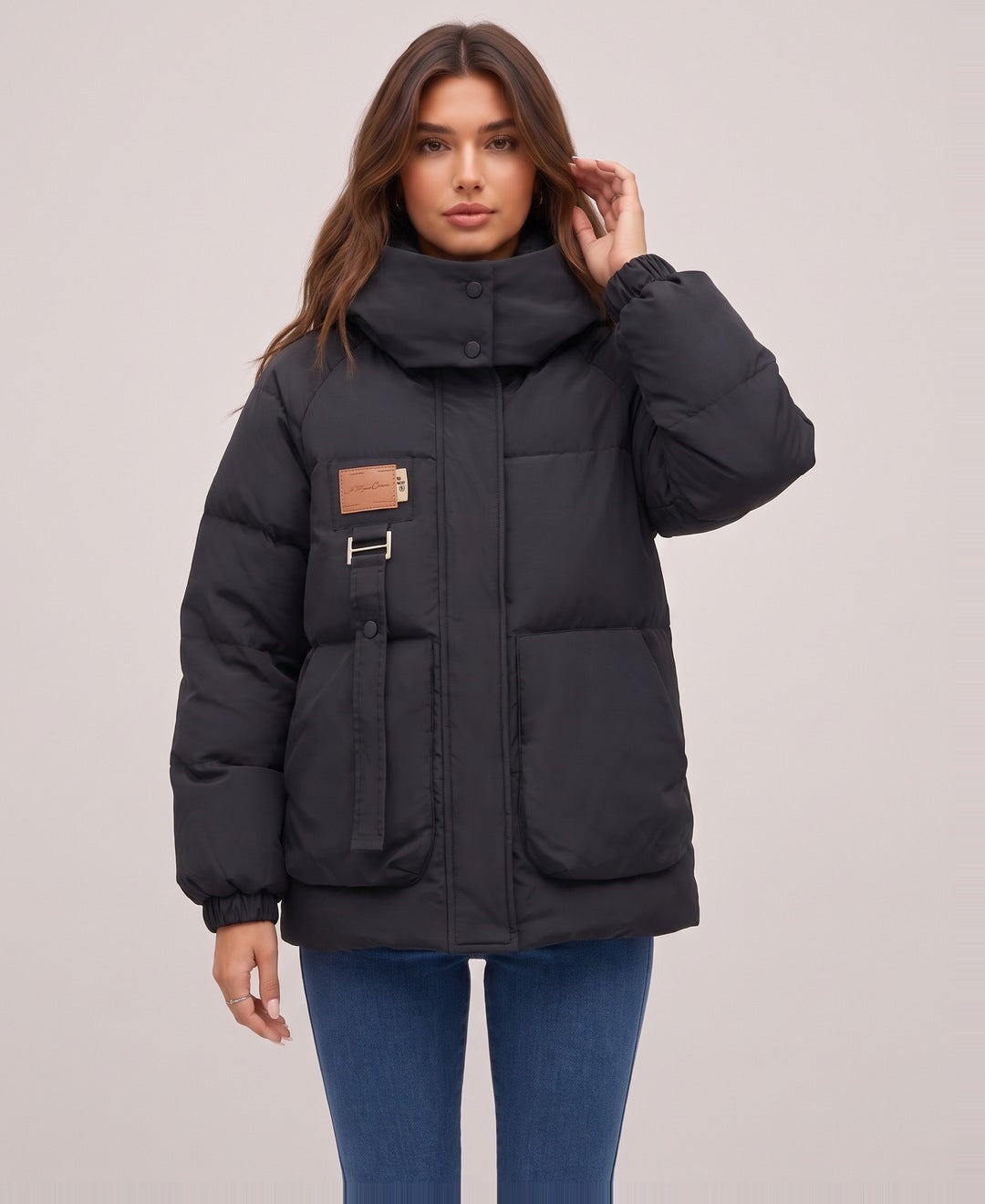 Black oversized hooded puffer jacket front view on model