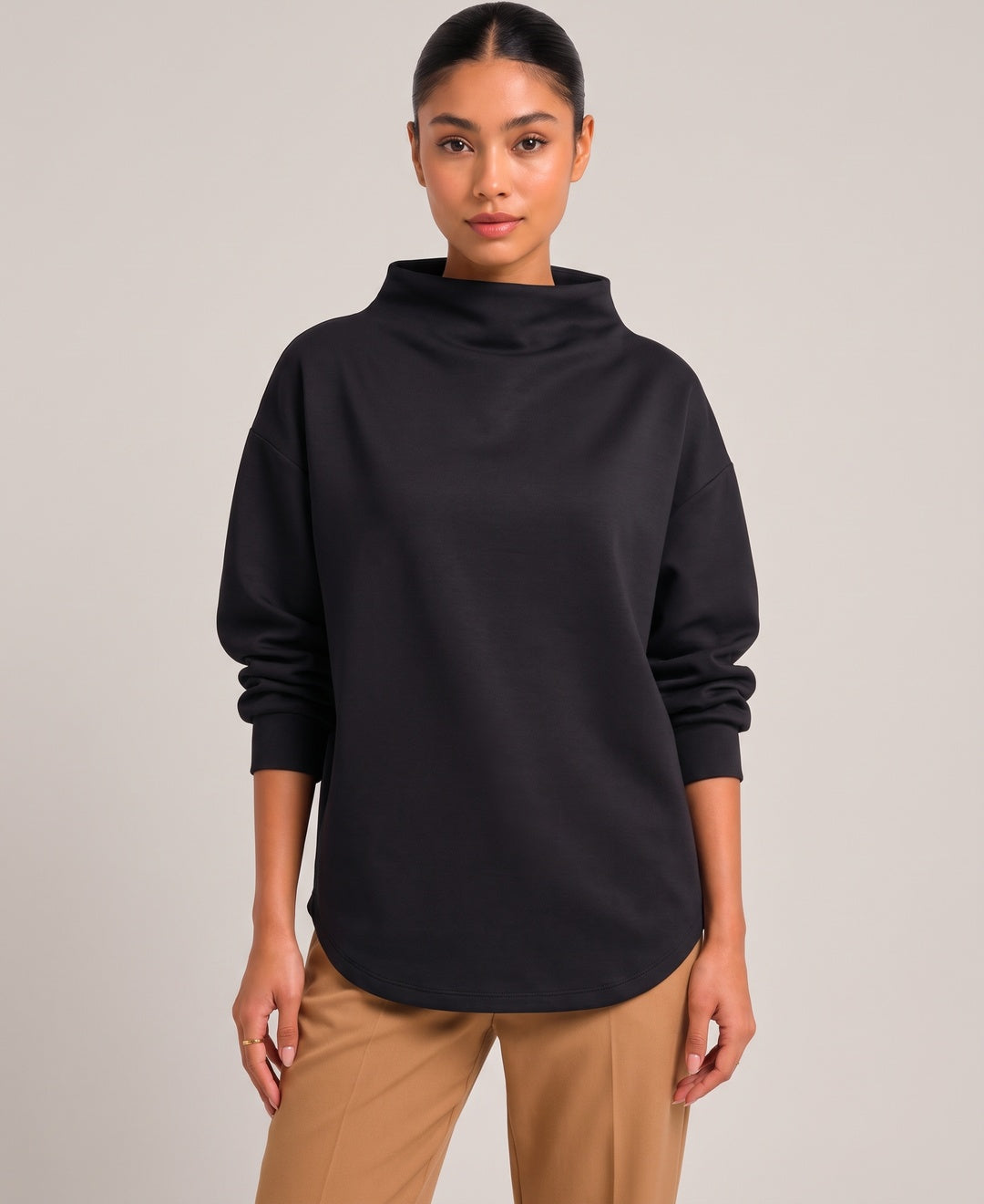 Women's oversized funnel neck top in black, front view