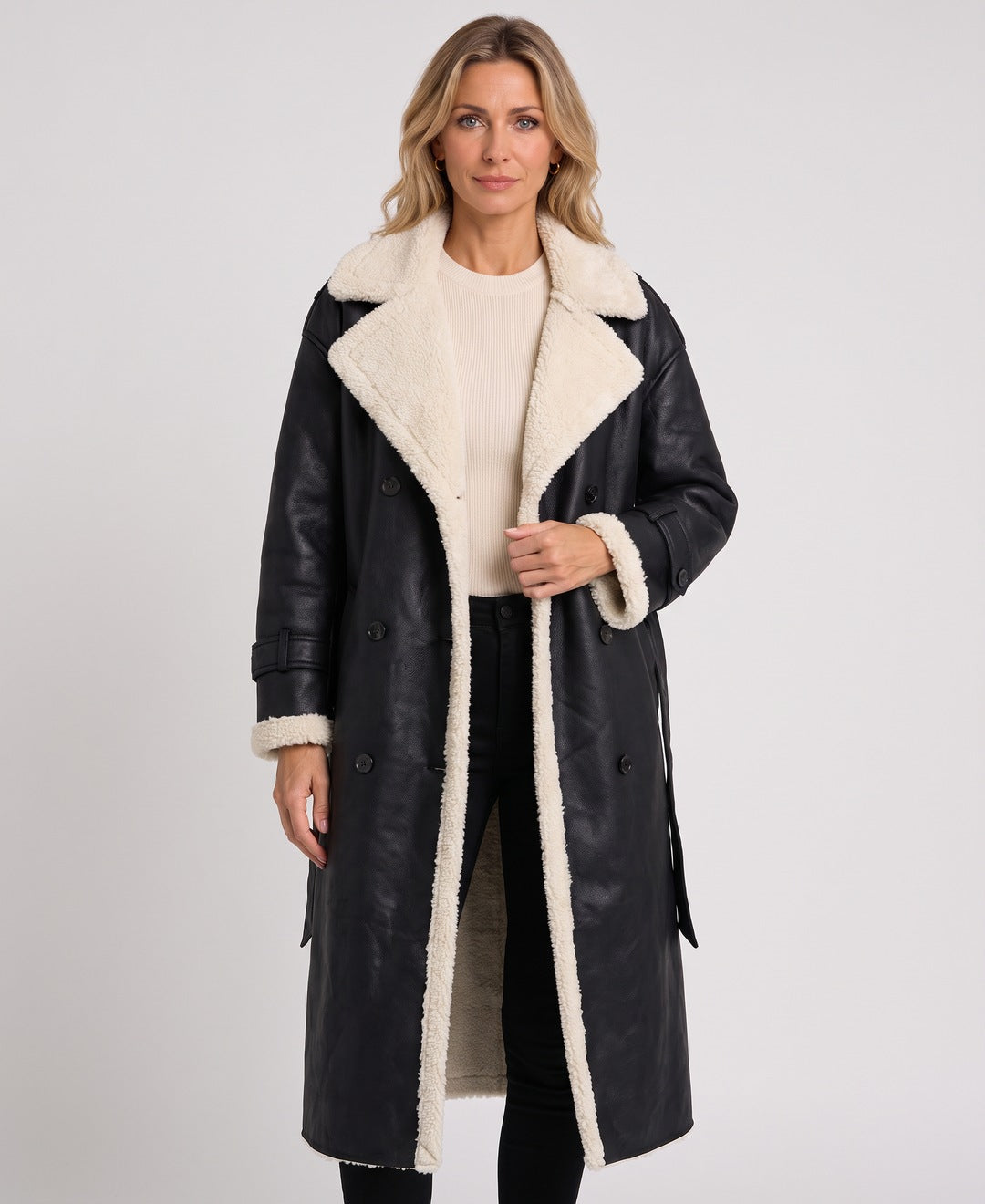 Black long faux leather coat with teddy lining, front view on model