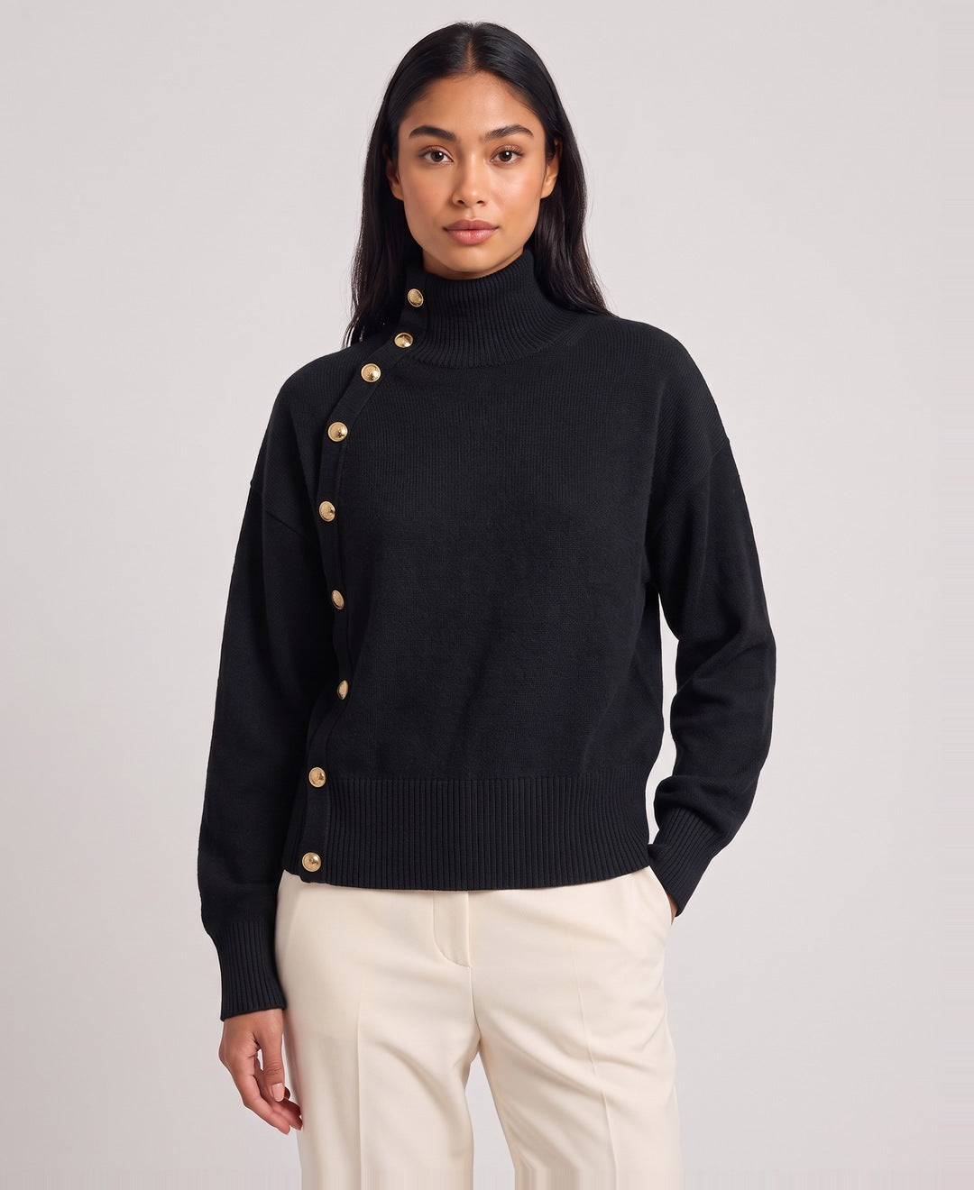 Black roll neck jumper front view on model