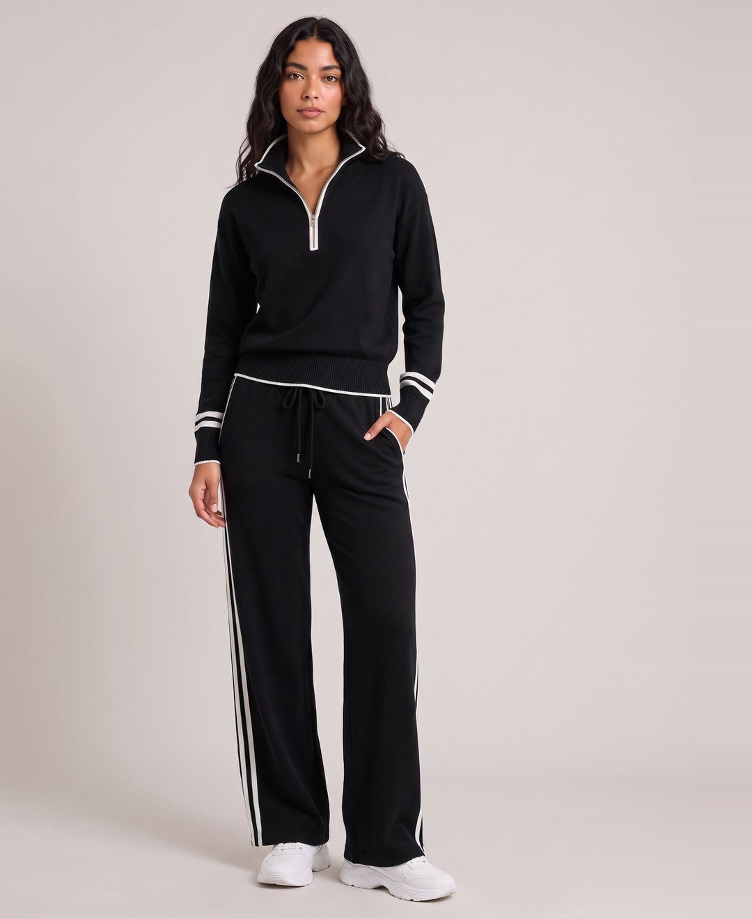 Black striped half zip knit set front view on model