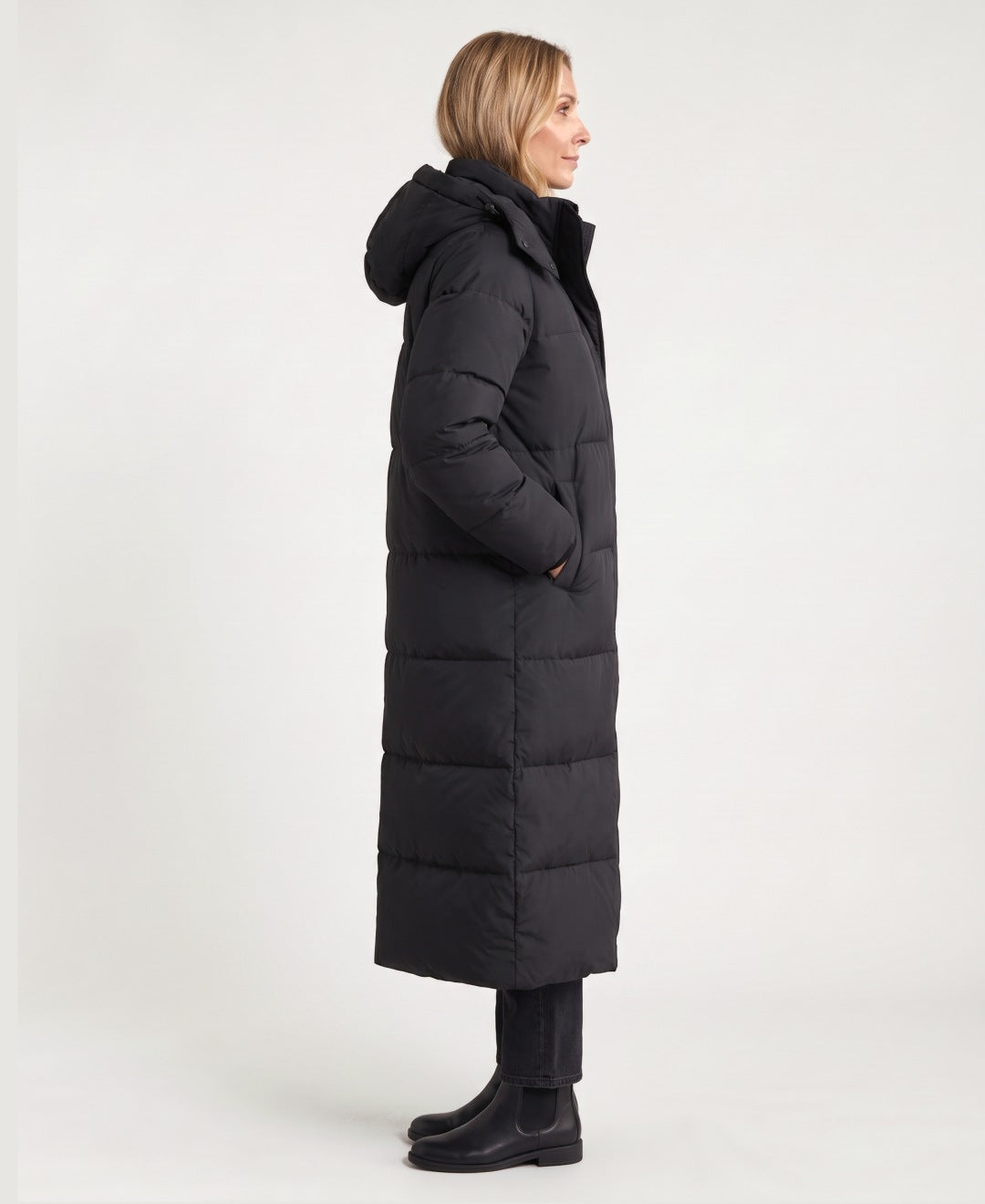 Women's long hooded puffer coat black side view