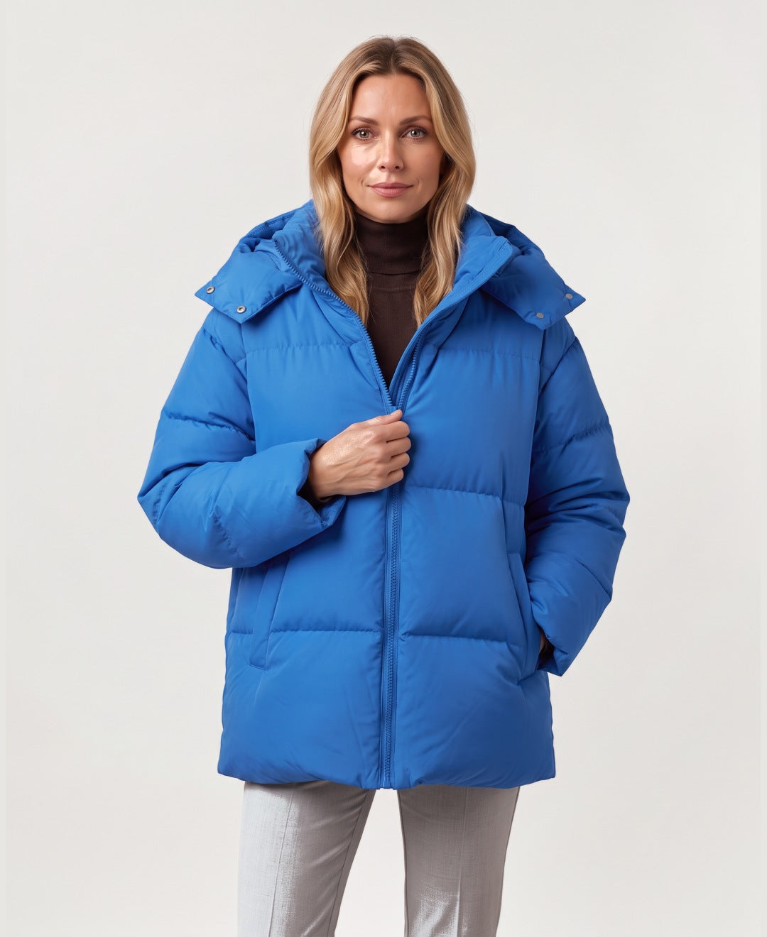 Women's oversized hooded puffer jacket blue front view
