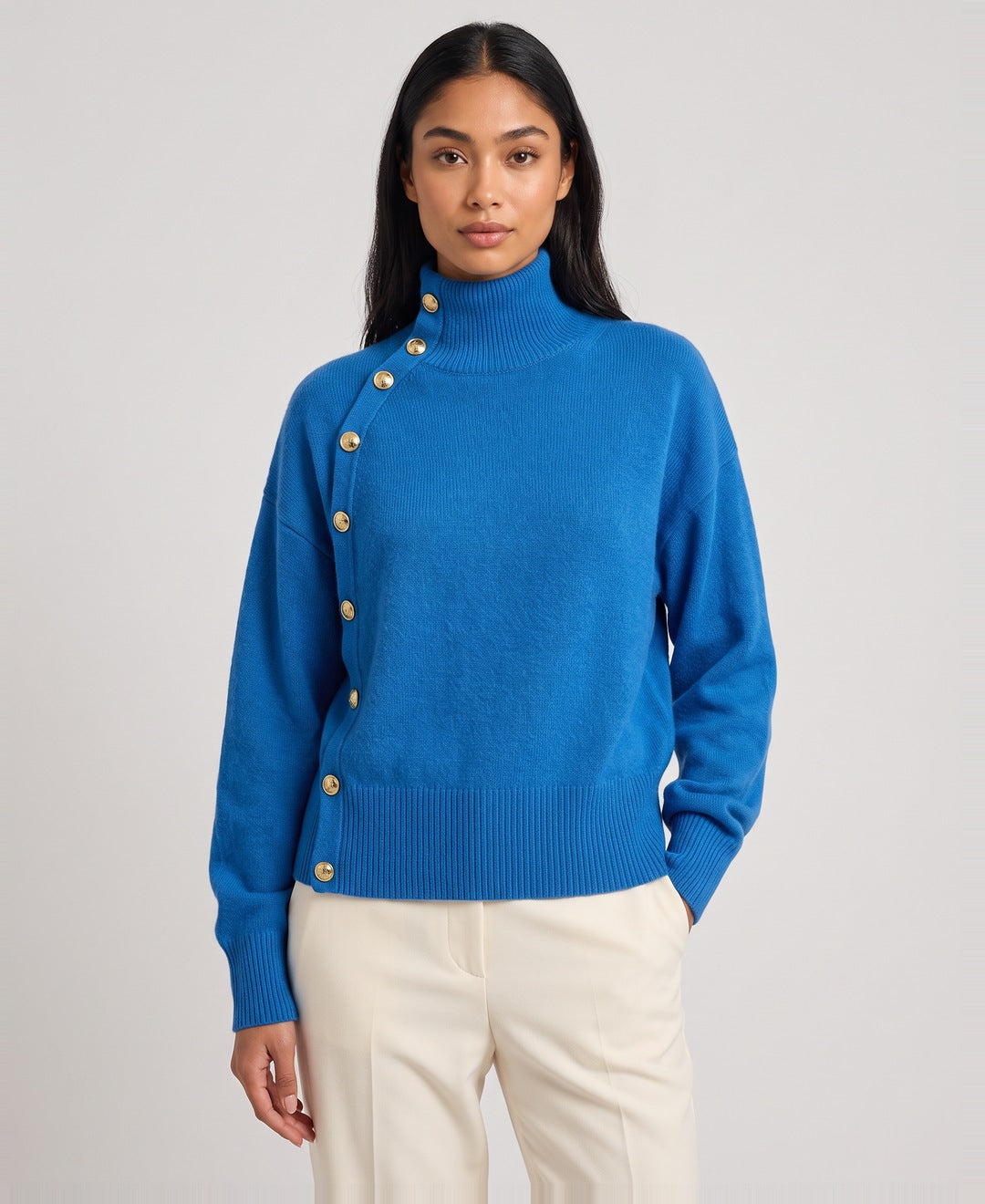 Blue roll neck jumper front view on model