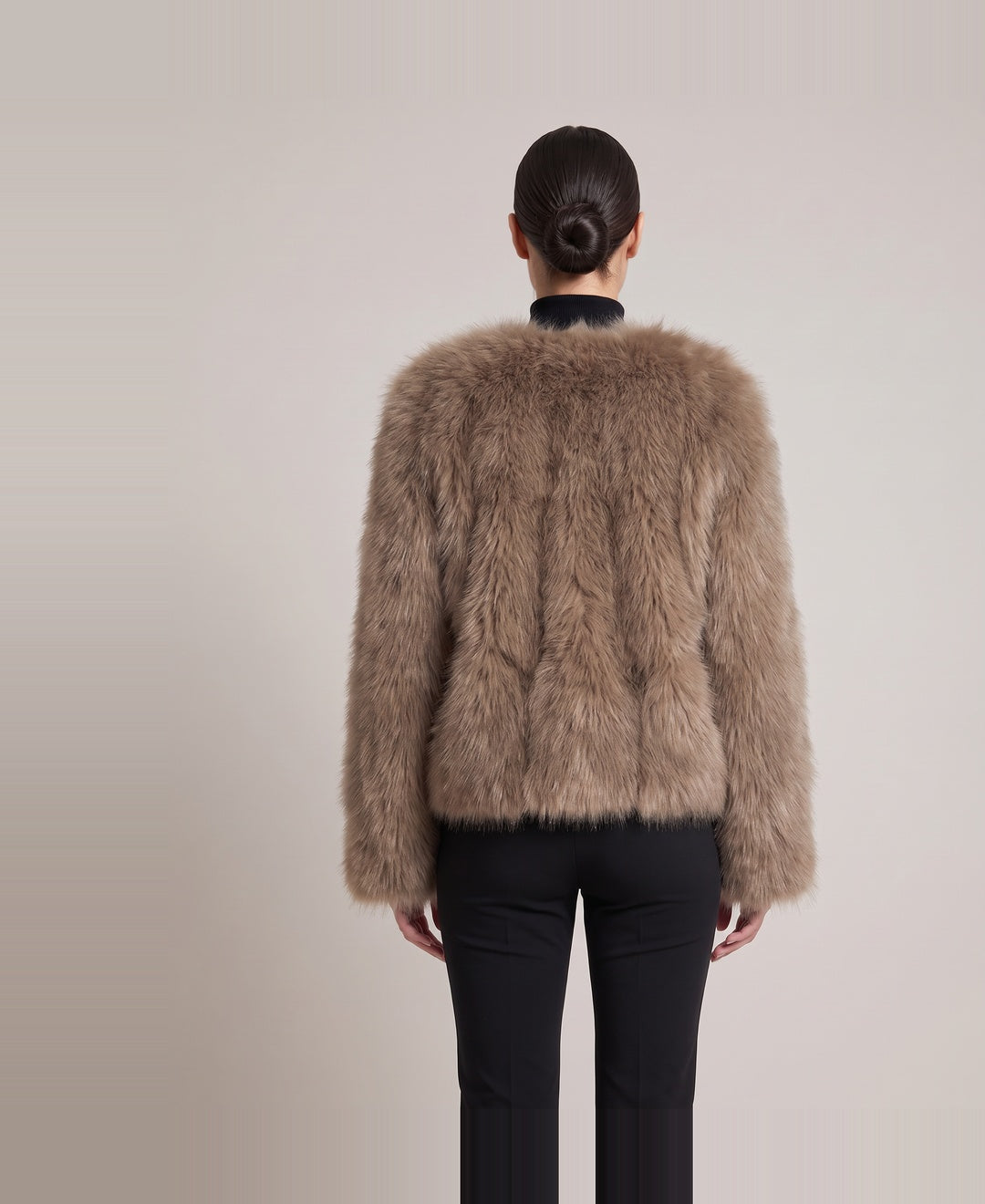 Women's cropped faux fur jacket in brown, back view