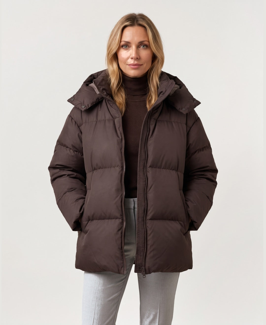 Women's oversized hooded puffer jacket brown front view
