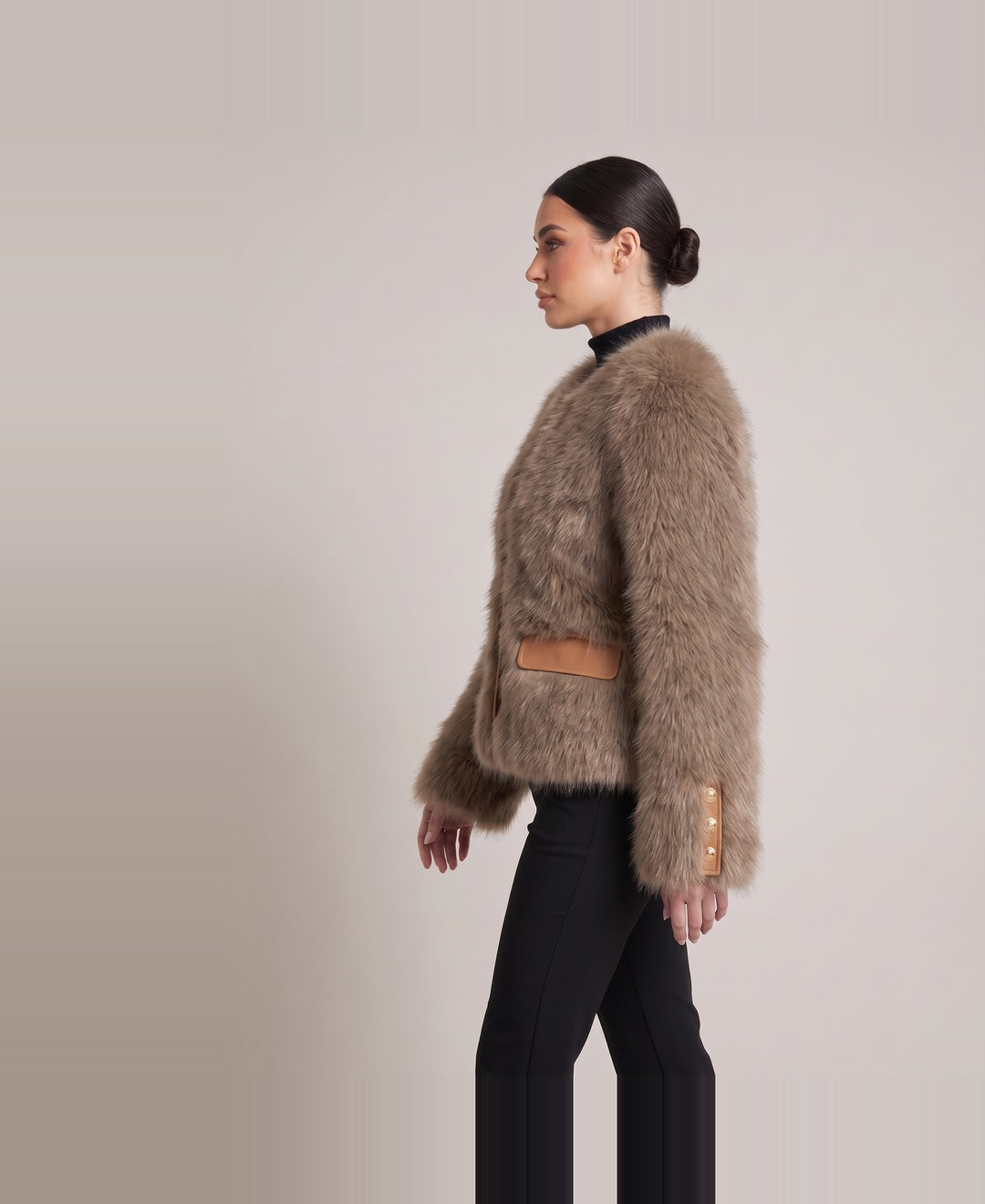 Women's cropped faux fur jacket in brown, side view