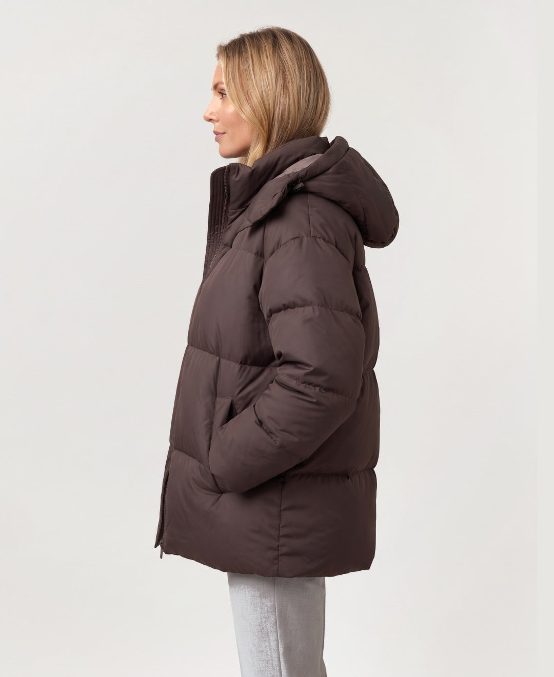 Women's oversized hooded puffer jacket brown side view