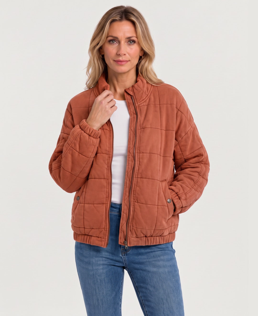 Women's quilted zip-up jacket burnt orange front view
