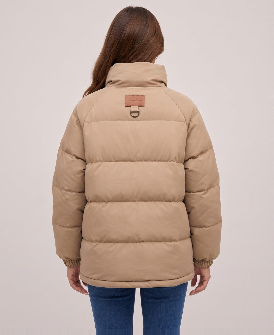 Camel oversized hooded puffer jacket back view on model