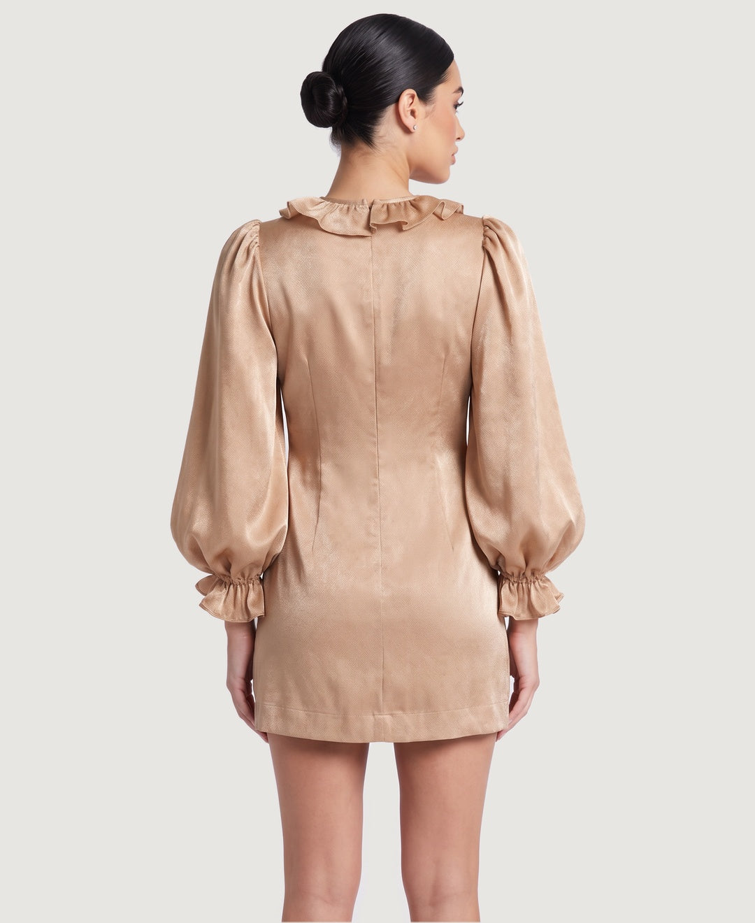 Women's satin ruffle front mini dress with puff sleeves in champagne, back view