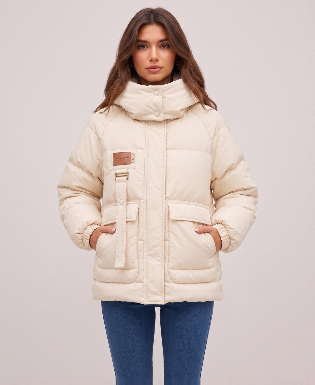 Cream oversized hooded puffer jacket front view on model