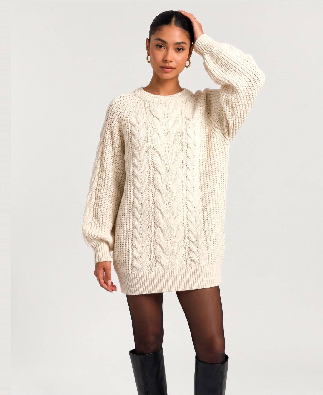 Women's chunky cable knit jumper dress in cream, front view