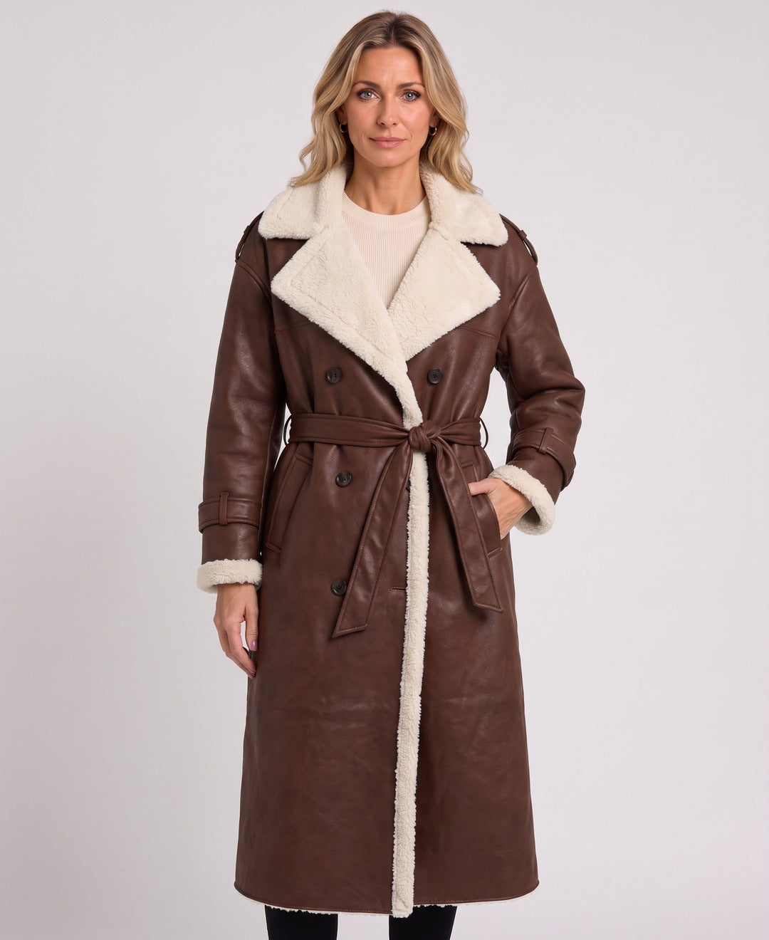 Dark brown long faux leather coat with teddy lining, front view on model