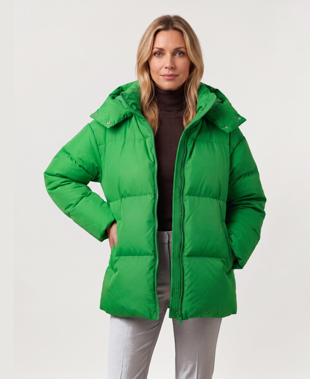 Women's oversized hooded puffer jacket green front view