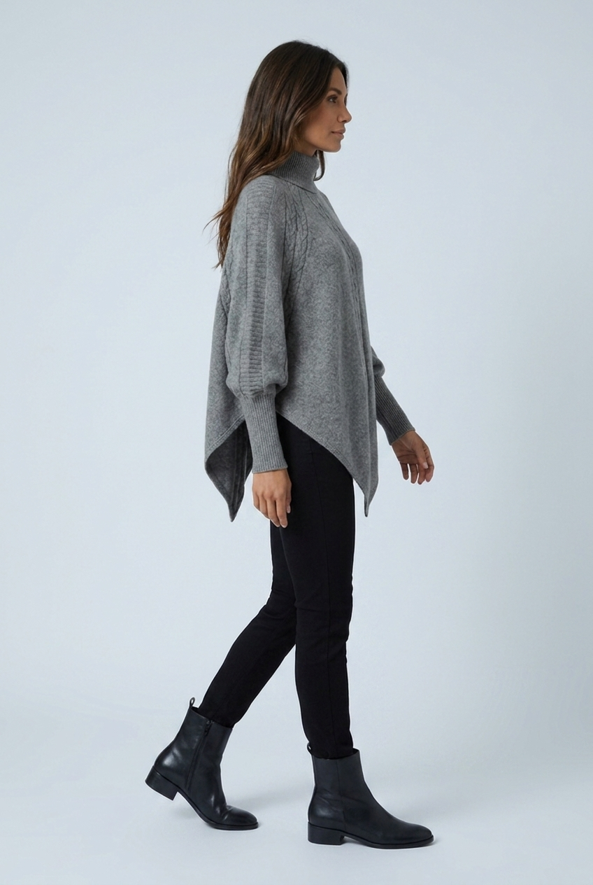 Grey cable knit turtleneck poncho side