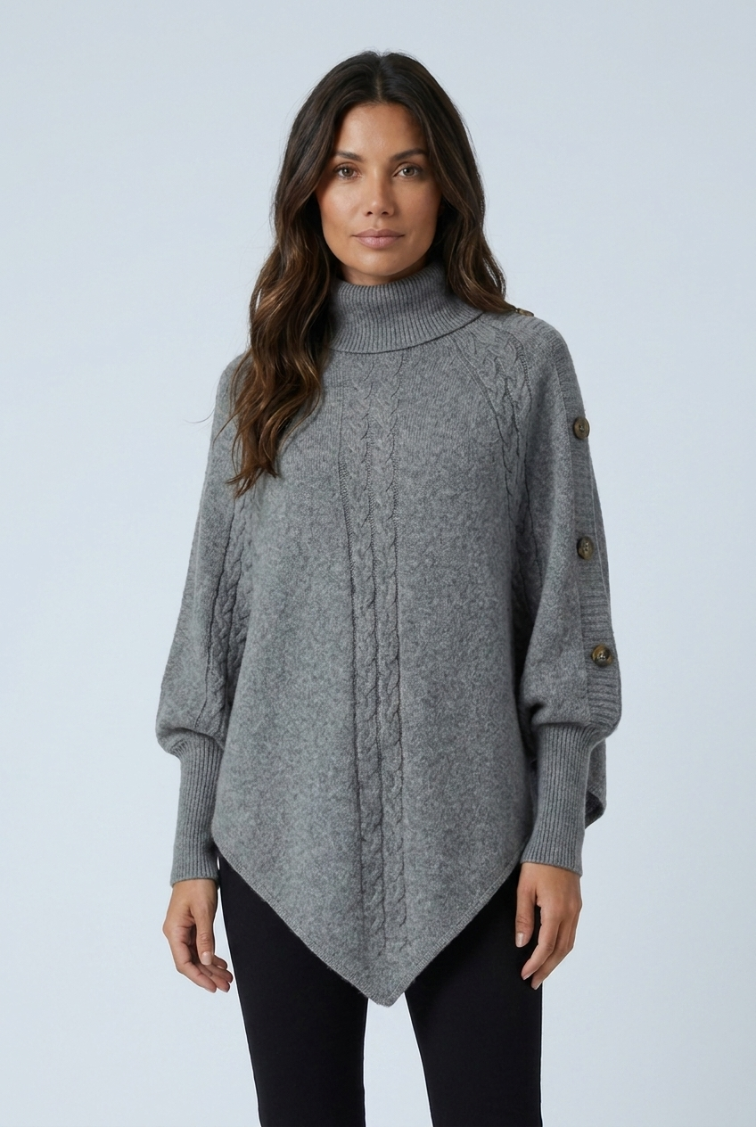 Grey cable knit turtleneck poncho closeup