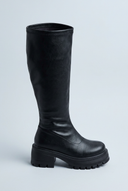 Black chunky lug sole knee high boots side