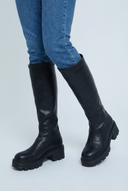 Black chunky lug sole knee high boots closeup
