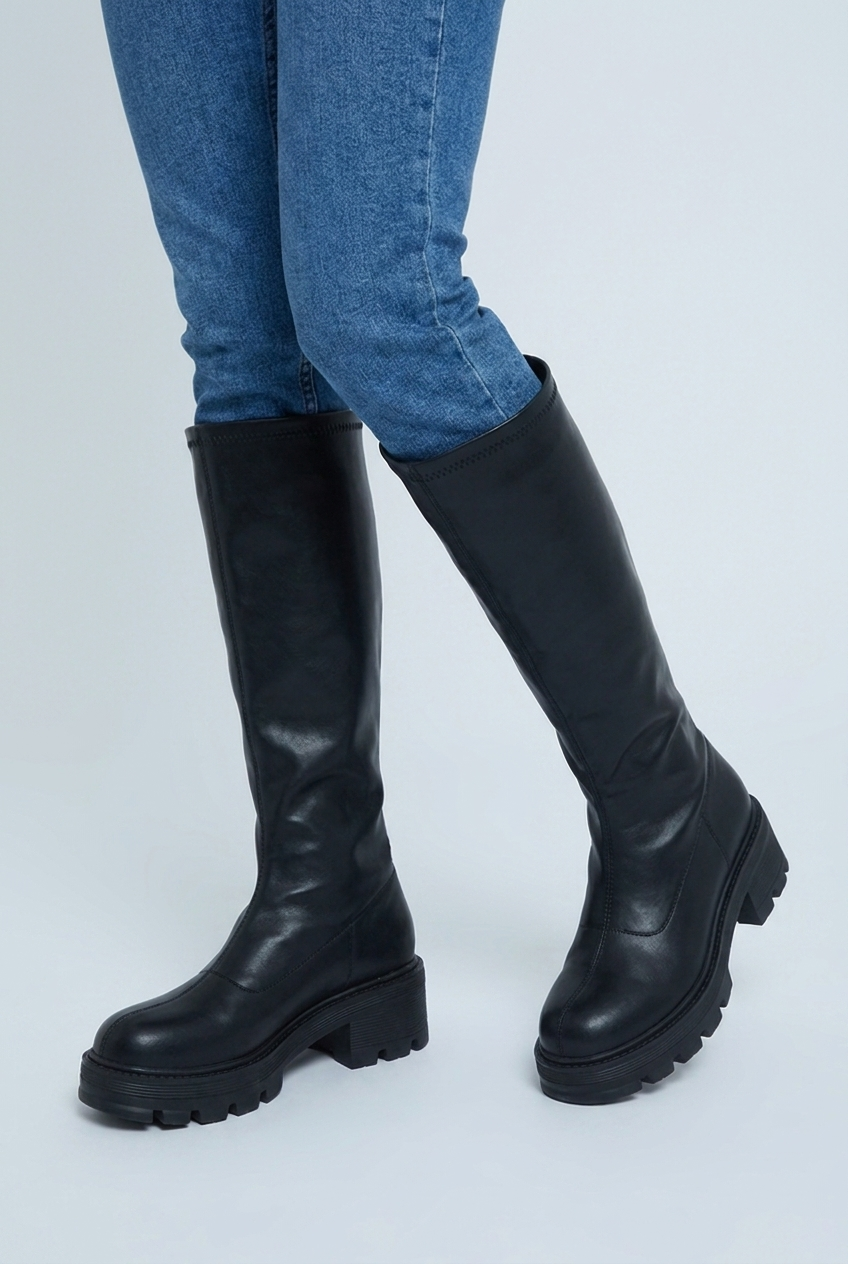 Black chunky lug sole knee high boots closeup