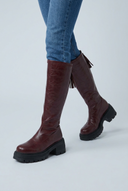 Burgundy chunky lug sole knee high boots closeup
