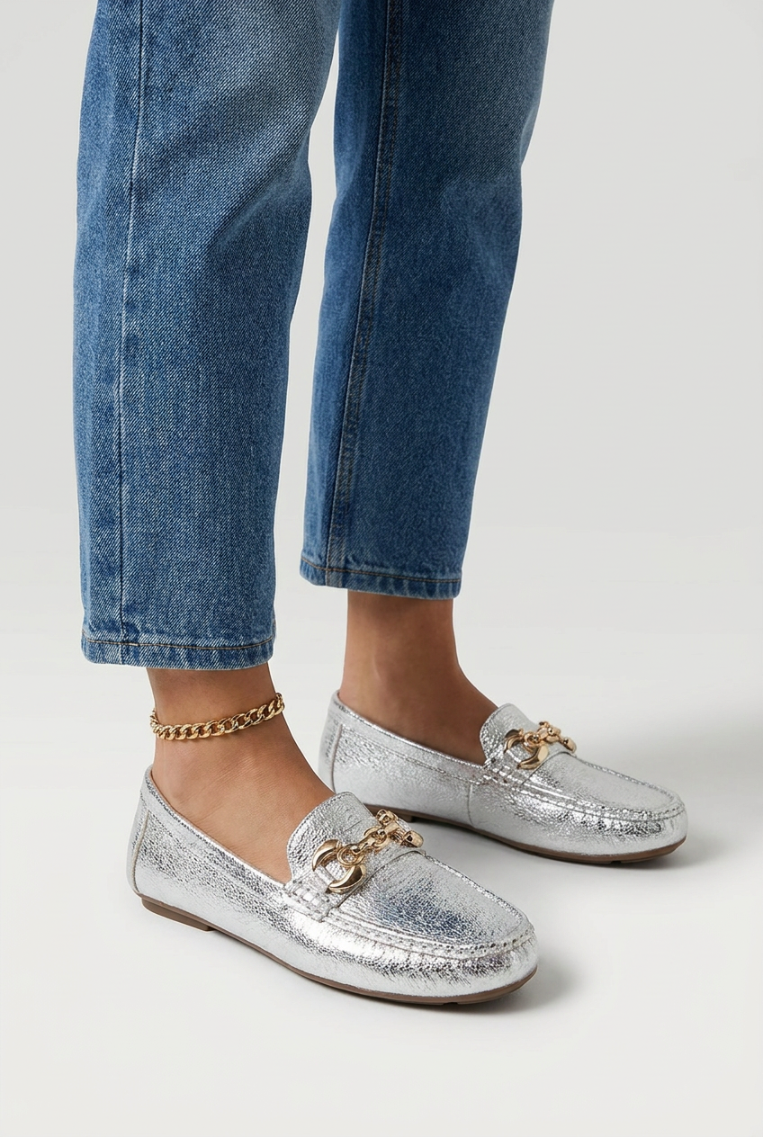Silver metallic silver driving loafers gold chain closeup