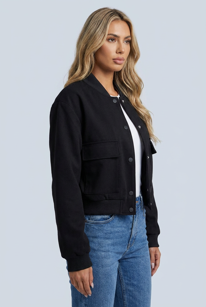 Black bomber jacket ribbed trim snap button front flap pockets cropped closeup