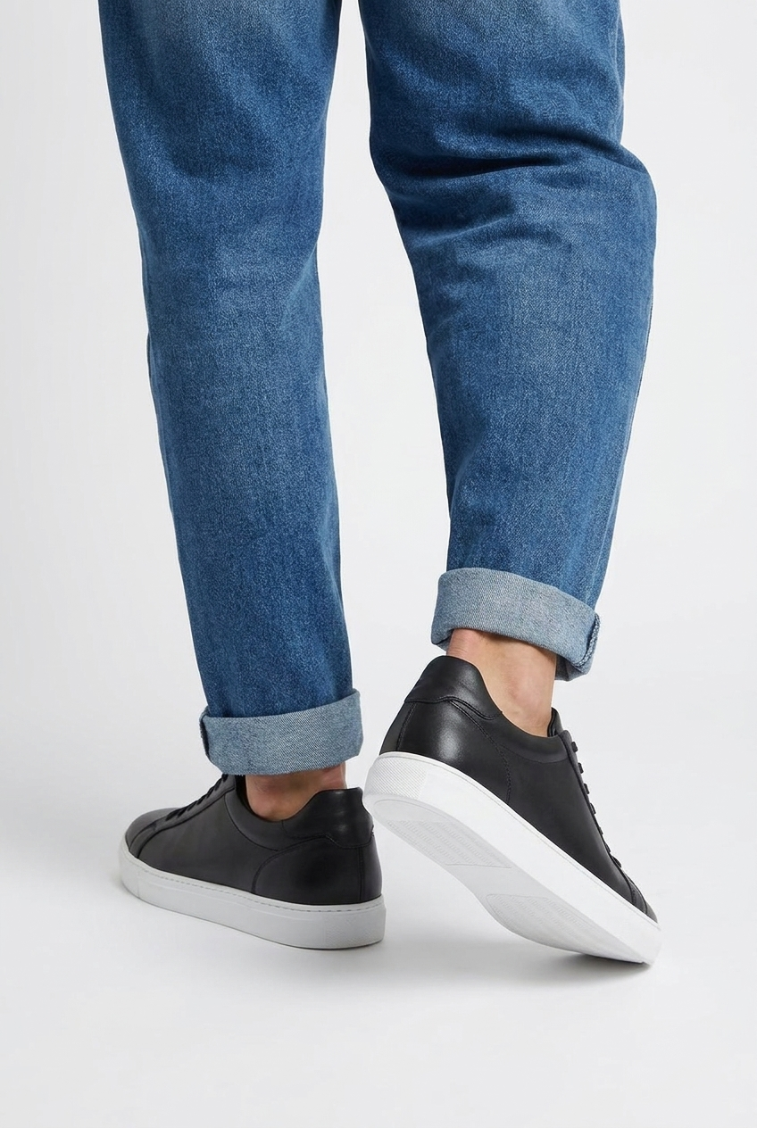 Carter men's minimalist leather-look low-top trainers in black, back view