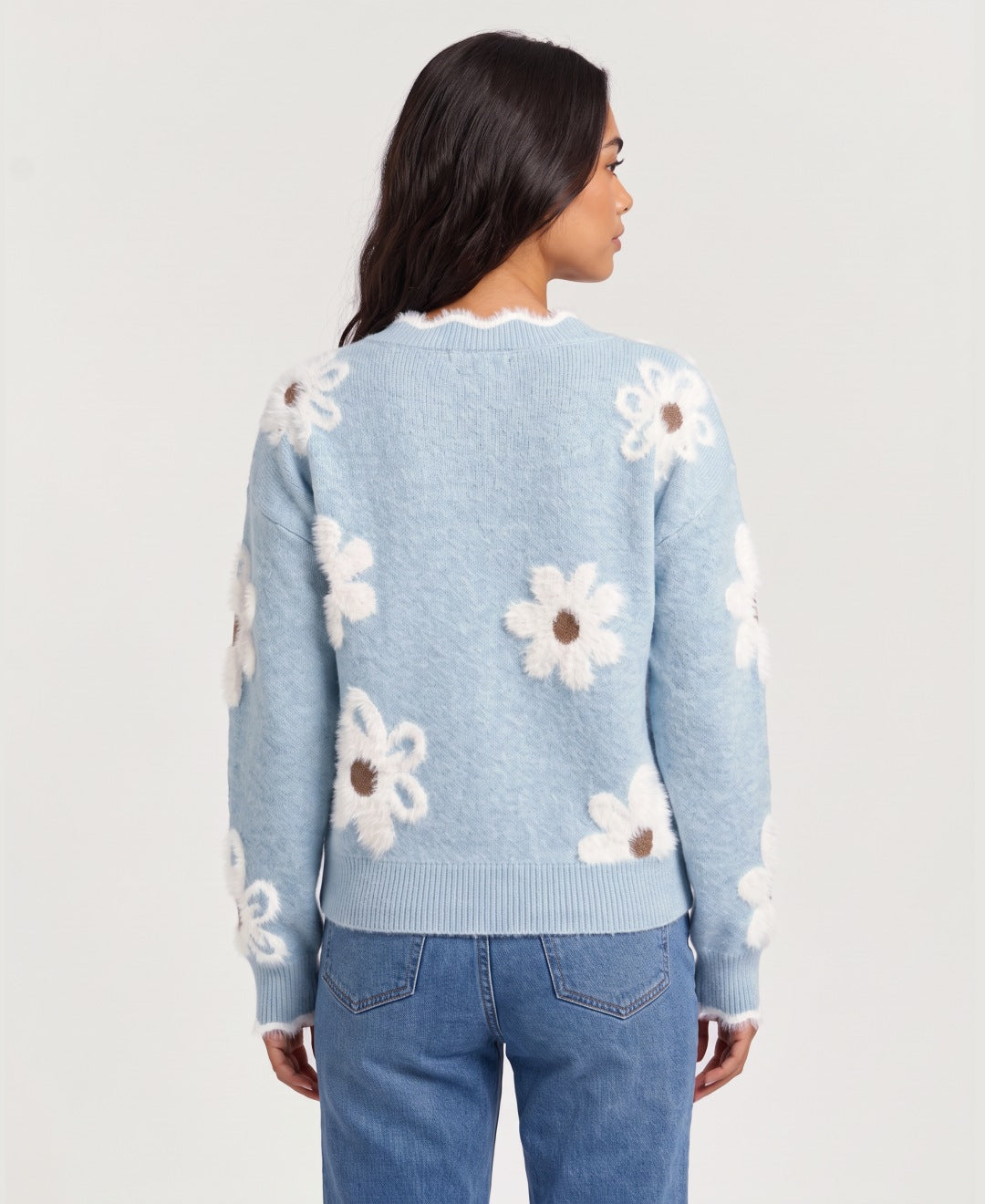 Women's V neck jumper with 3D daisy appliques in light blue, back view