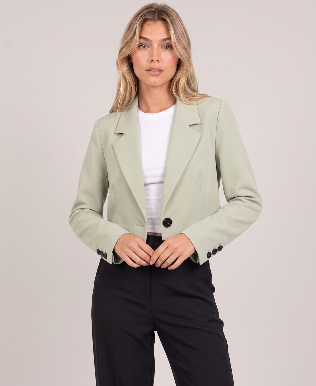 Women's cropped blazer in light green, front view