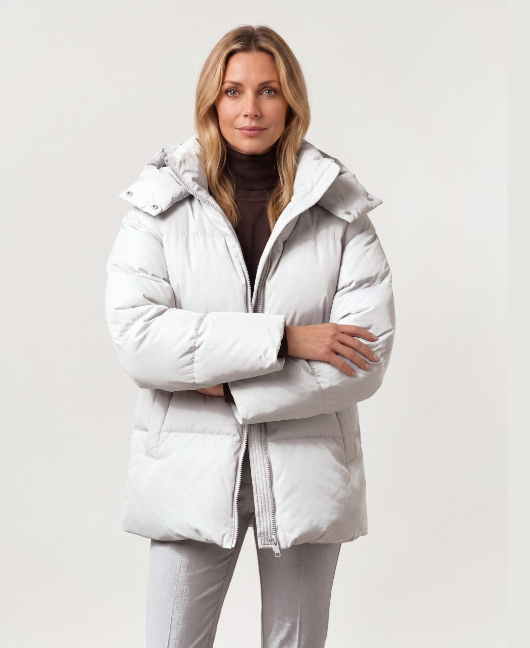 Women's oversized hooded puffer jacket light grey front view