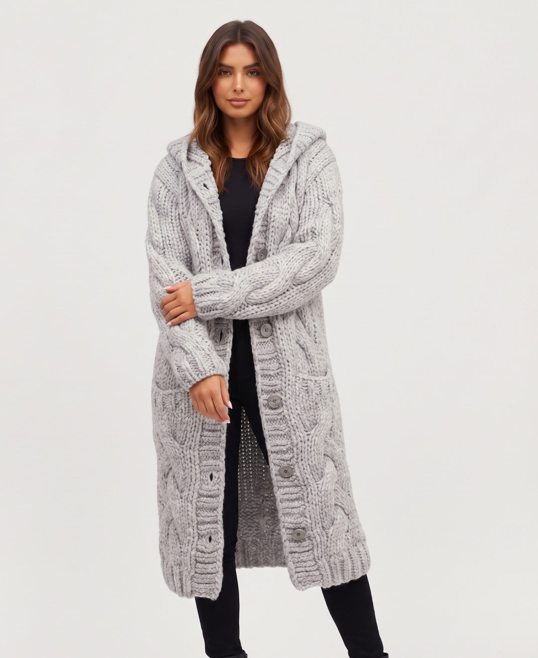 Women's long chunky cable knit hooded cardigan in light grey, front view