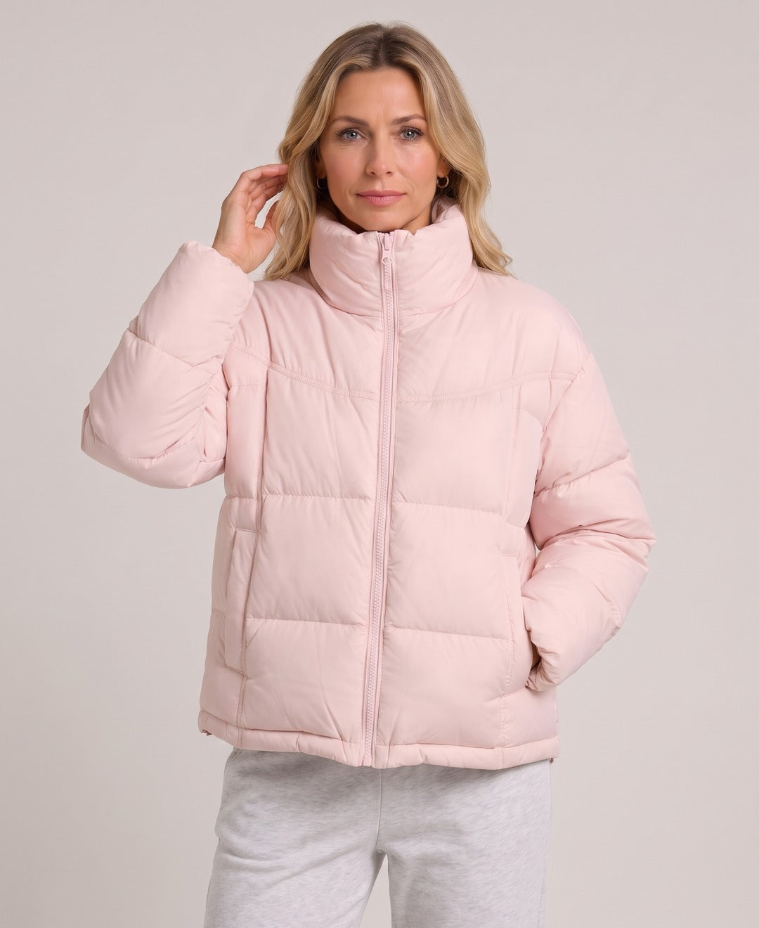 Women's Short Puffer Jacket Stand Collar Zip Front Drawstring Hem in Light Pink, front view