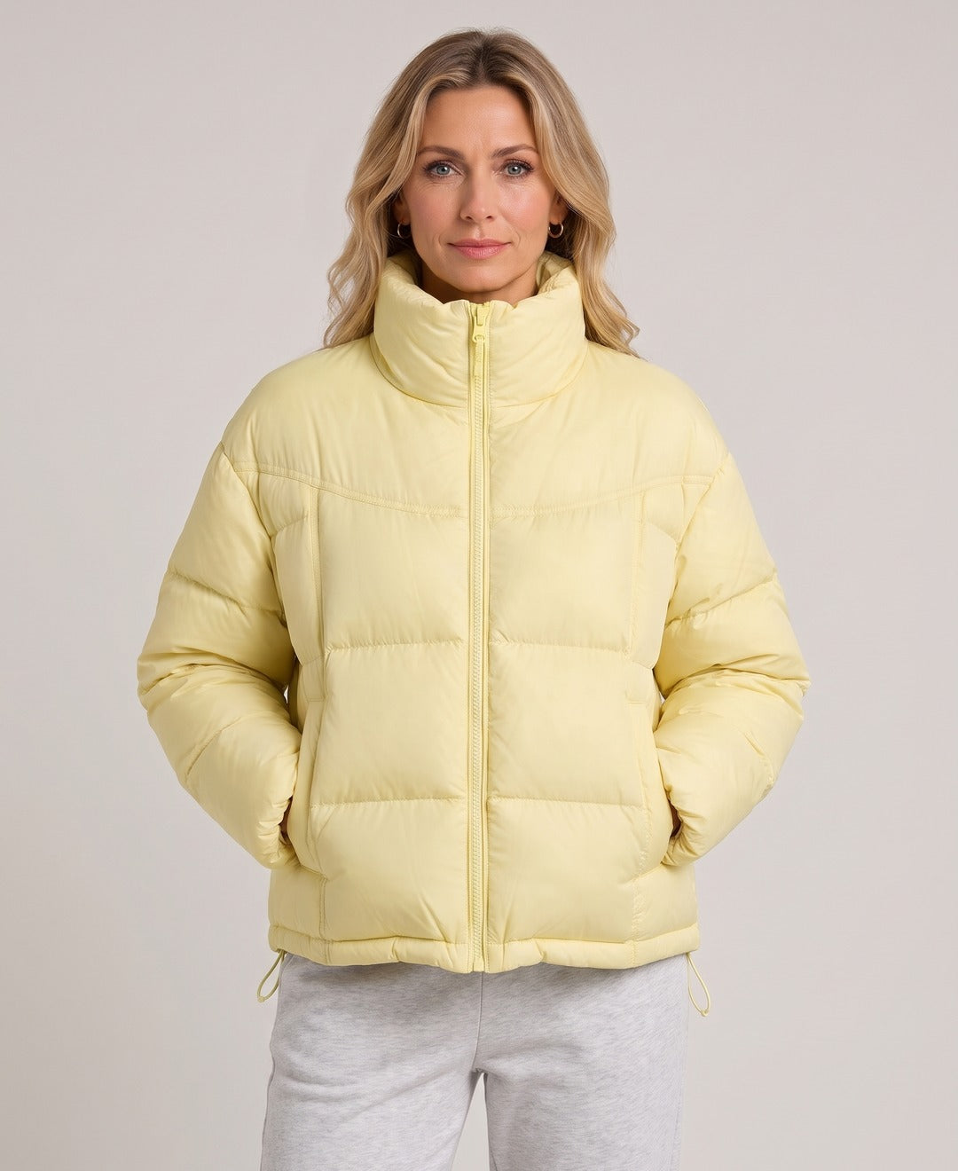 Women's Short Puffer Jacket Stand Collar Zip Front Drawstring Hem in Light Yellow, front view