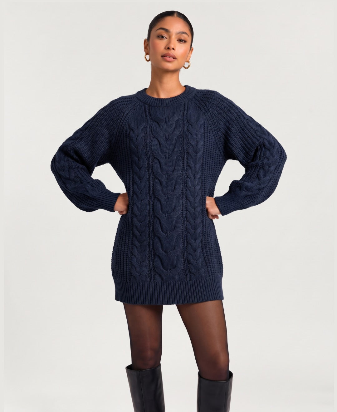 Women's chunky cable knit jumper dress in navy, front view