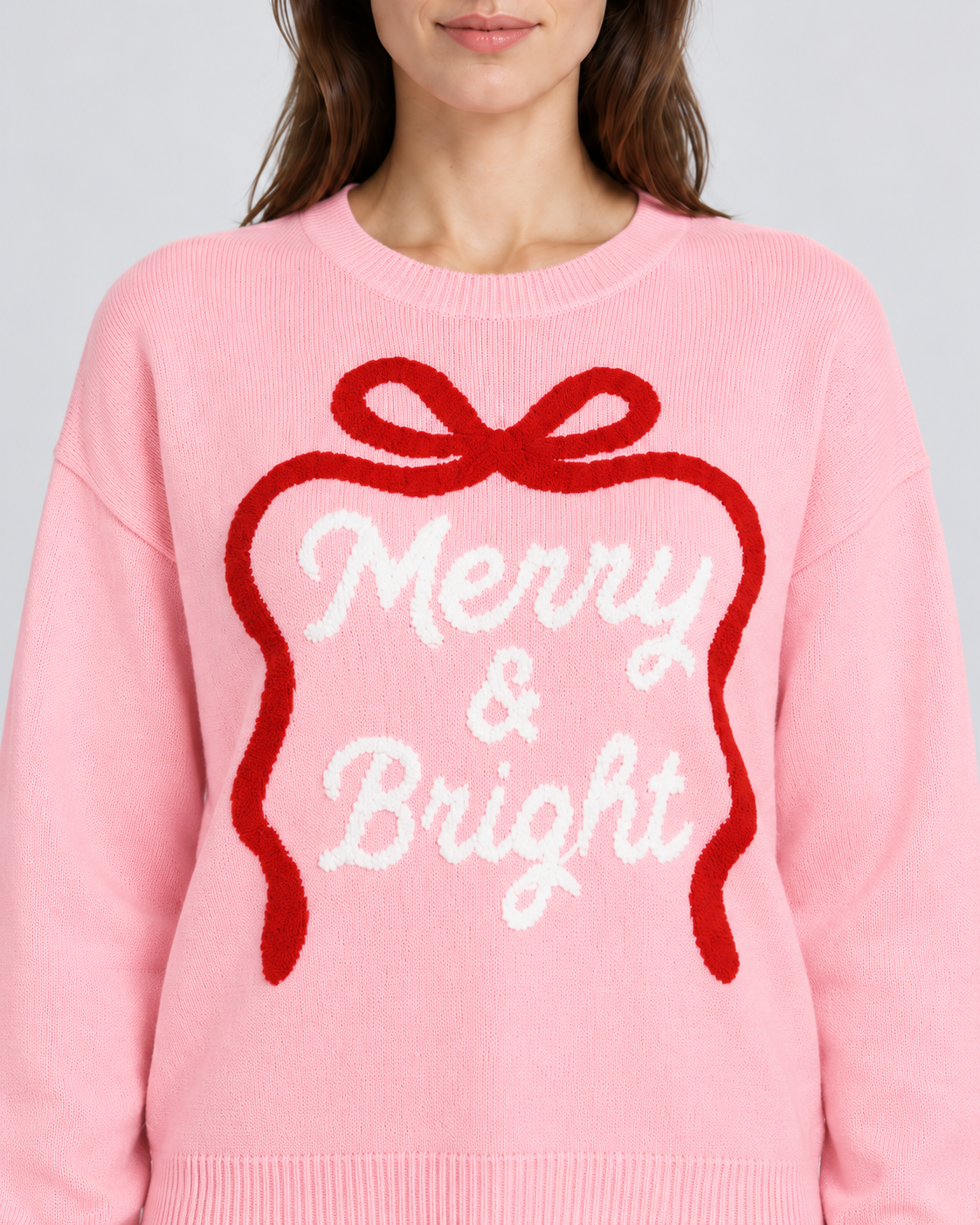 Embroidered Bow Slogan Crew Neck Christmas Jumper, raised embroidered bow and Merry and Bright lettering, close-up