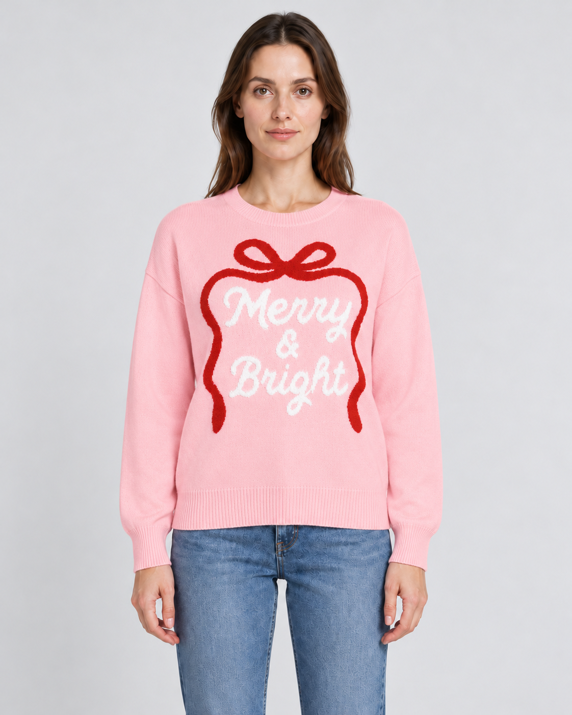 Embroidered Bow Slogan Crew Neck Christmas Jumper, pink Christmas jumper with embroidered bow and Merry and Bright slogan, front view