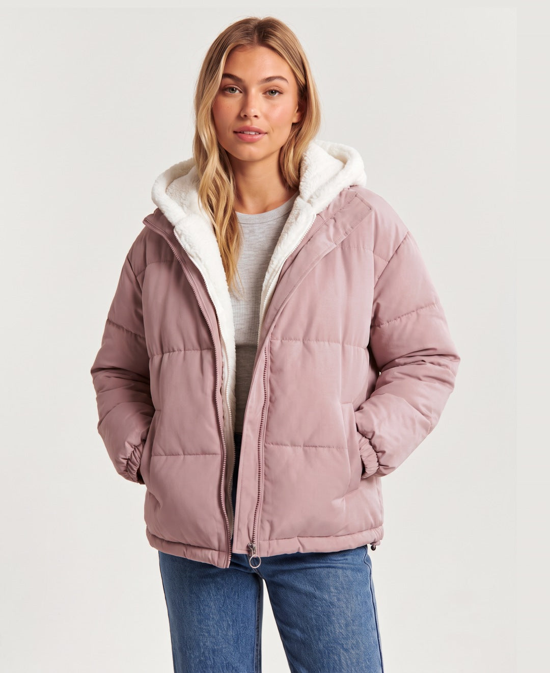 Women's hooded puffer jacket with sherpa fleece hood in pink, front view