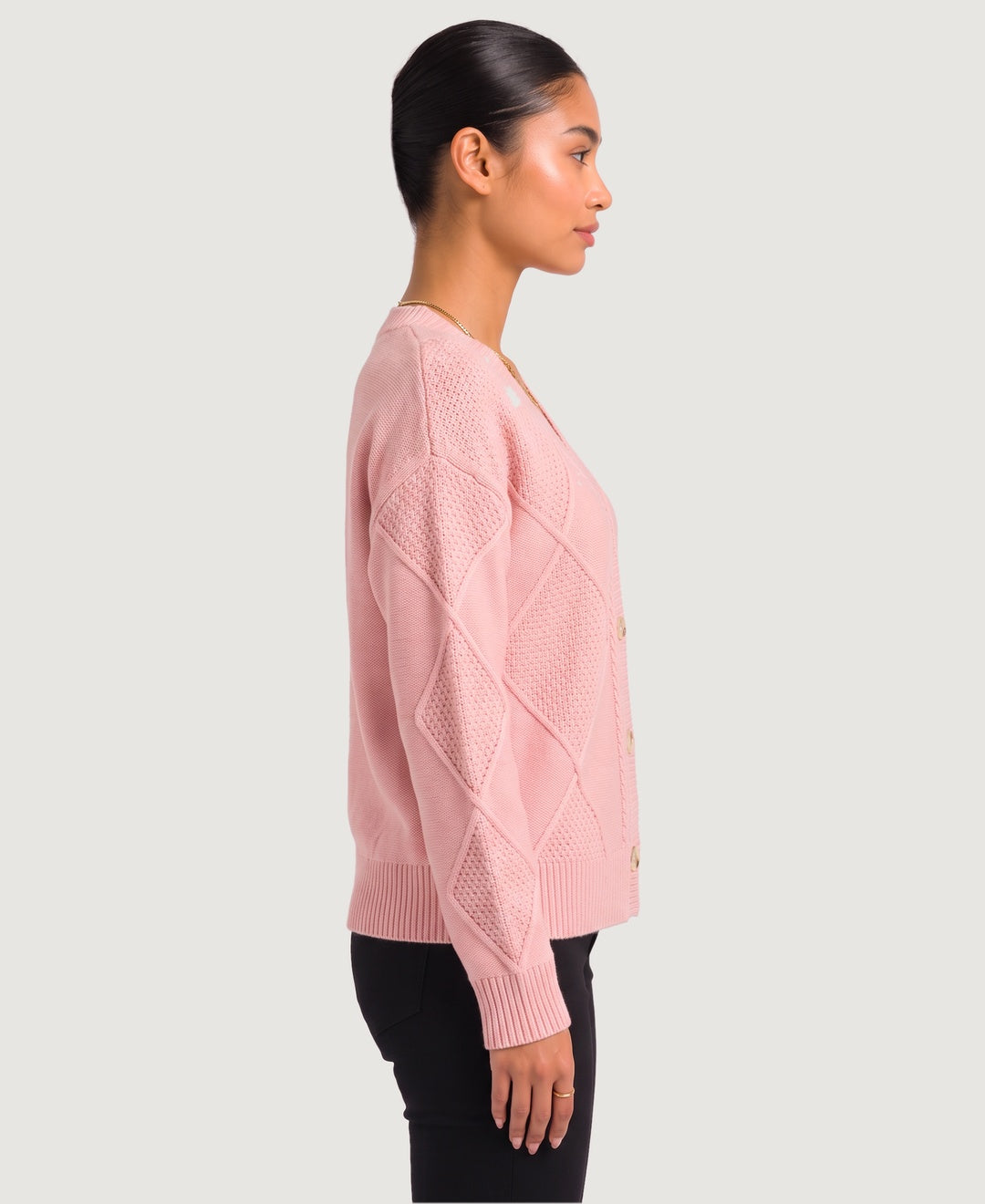 Women's diamond cable knit V-neck button cardigan in pink, side view