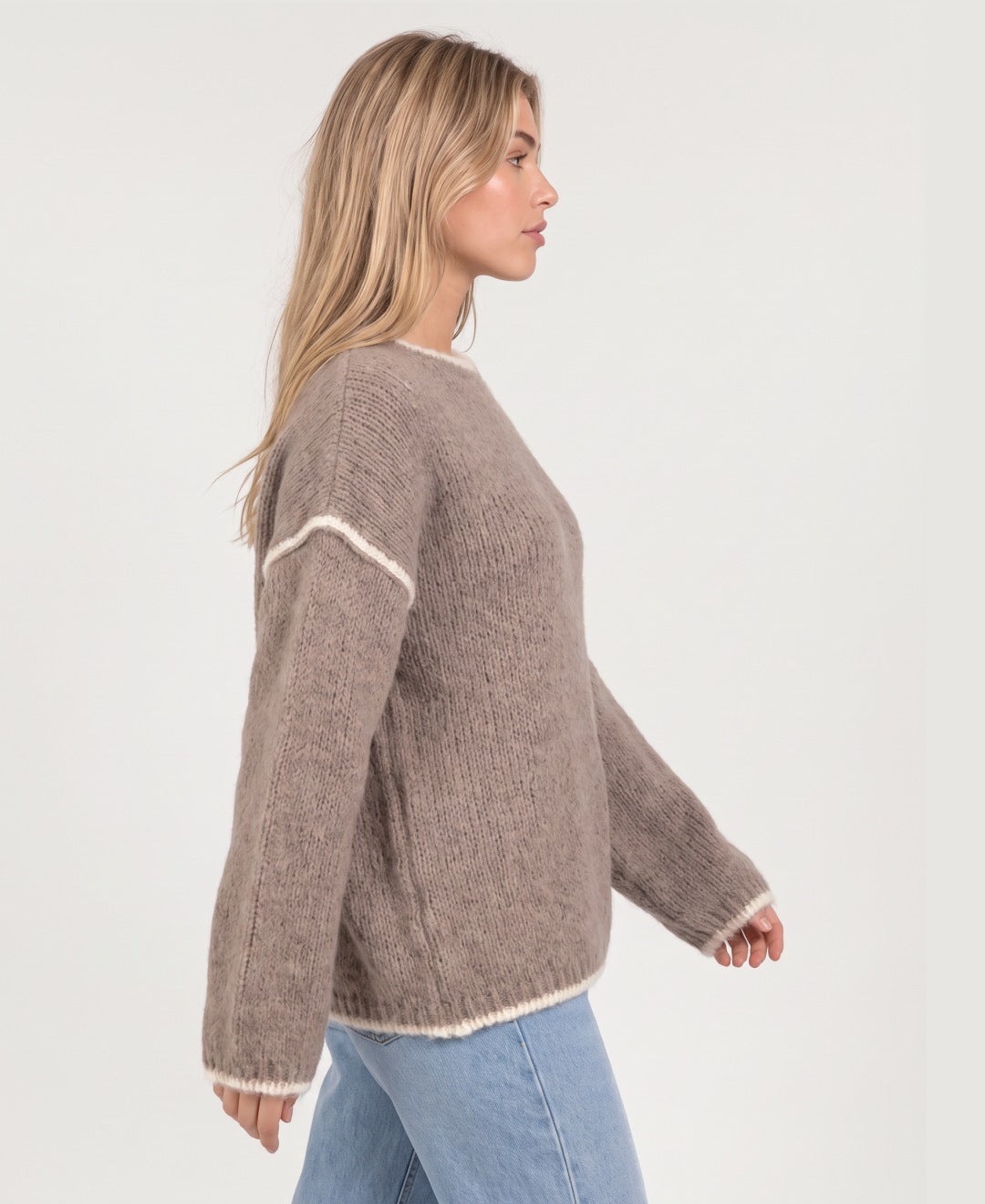 Women's oversized crew neck knit jumper with contrast edging in taupe, side view