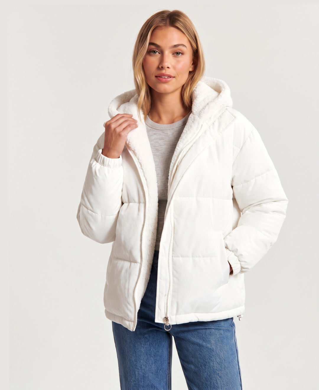 Women's hooded puffer jacket with sherpa fleece hood in white, front view